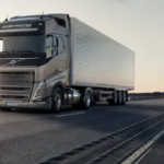 GREY-VOLVO-TRUCK-UNDER-ORANGE-SKY