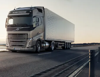 GREY-VOLVO-TRUCK-UNDER-ORANGE-SKY